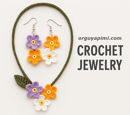 A handmade crochet jewelry set featuring blue forget-me-not flowers, including earrings, a necklace, and a bracelet