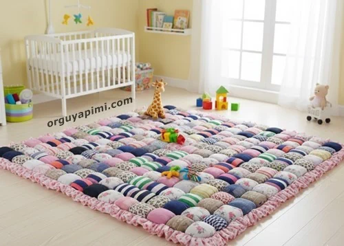 Upcycled sock puff play mat for babies with soft padded surface